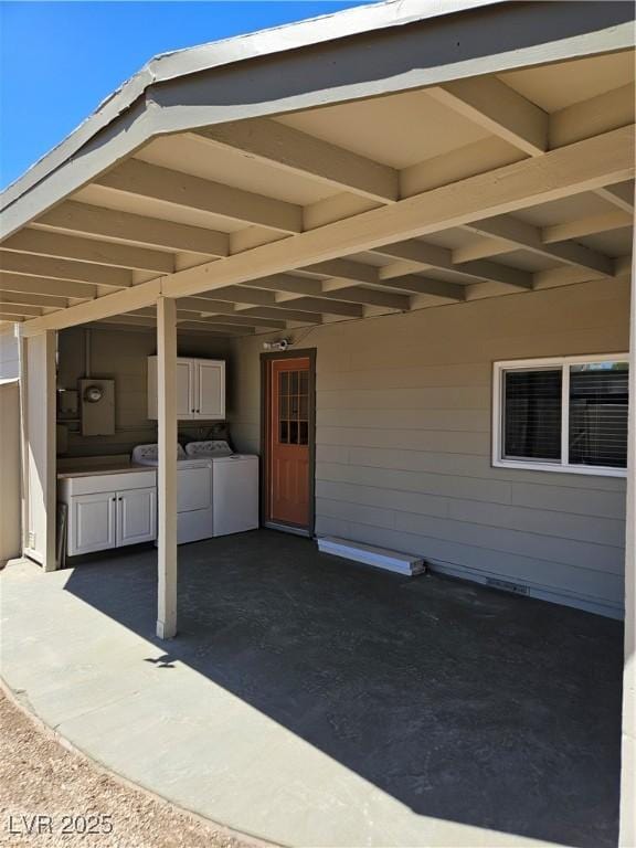 131 Copper St, Henderson, NV 89015 - view of patio featuring washing machine and clothes dryer and an outdoor kitchen