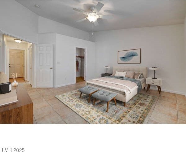 bedroom with light tile patterned floors, lofted ceiling, a walk in closet, a closet, and ceiling fan