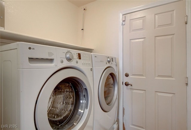clothes washing area featuring separate washer and dryer