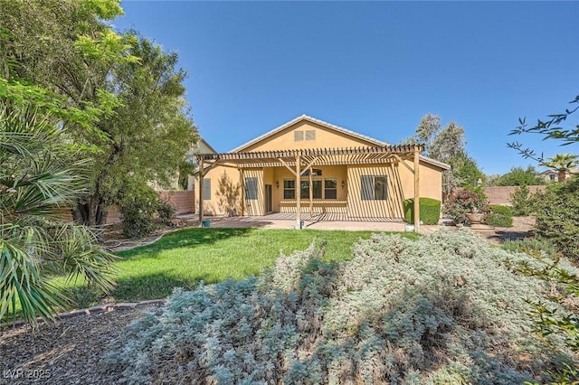 back of house featuring a pergola, stucco siding, and a patio area