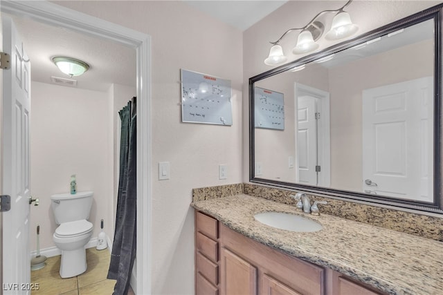 full bath with vanity, toilet, and tile patterned flooring