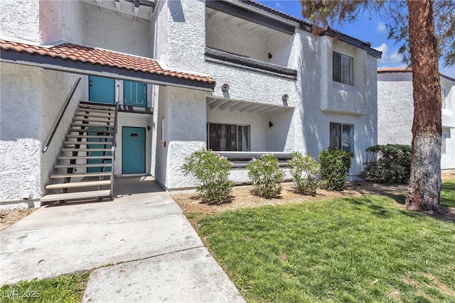 view of property featuring stairs