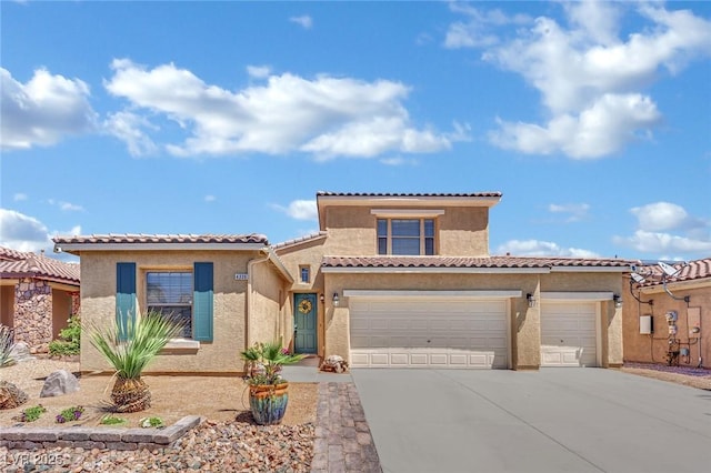 view of front of property with concrete driveway, stucco siding, an attached garage, and a tile roof