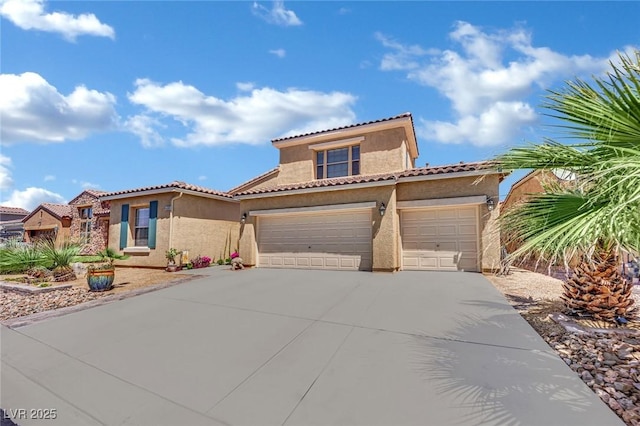 mediterranean / spanish house featuring stucco siding, driveway, a tiled roof, and an attached garage