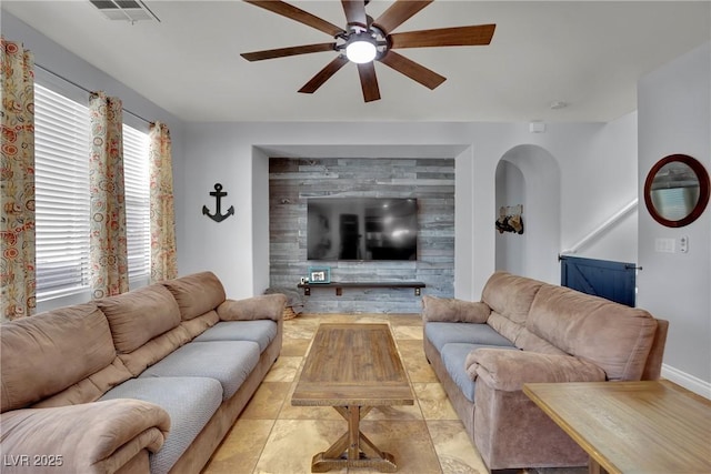 living area with a ceiling fan