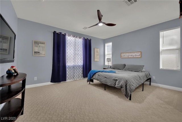 bedroom with carpet floors, baseboards, and ceiling fan