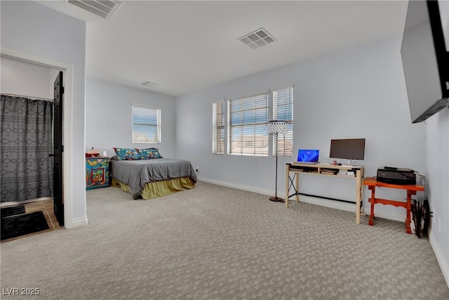 bedroom featuring carpet floors, baseboards, and an office area