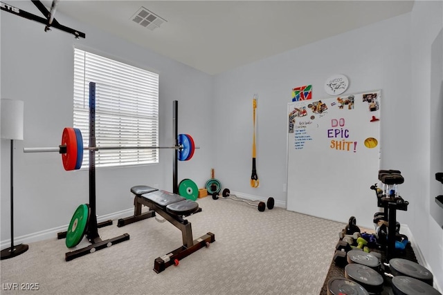 exercise room with carpet flooring and baseboards