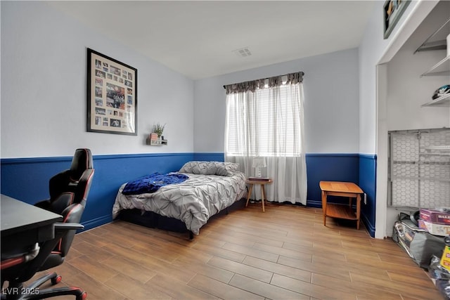bedroom with wood finished floors