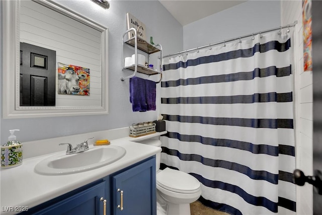 bathroom with vanity, toilet, and a shower with curtain