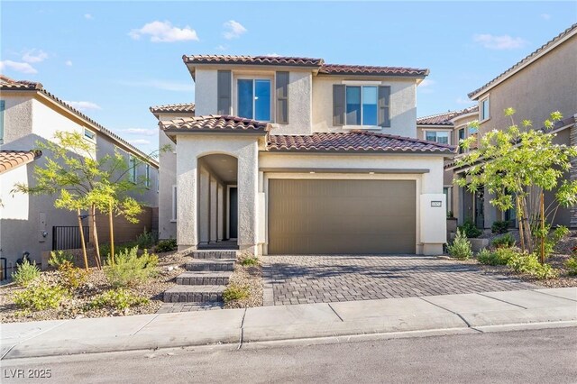 10851 Hanwicke Harbor Ave, Las Vegas, NV 89166 - mediterranean / spanish home with stucco siding, a tiled roof, a garage, and driveway