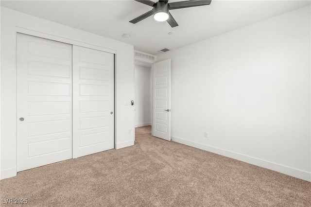 10851 Hanwicke Harbor Ave, Las Vegas, NV 89166 - unfurnished bedroom featuring light colored carpet, a closet, baseboards, and ceiling fan
