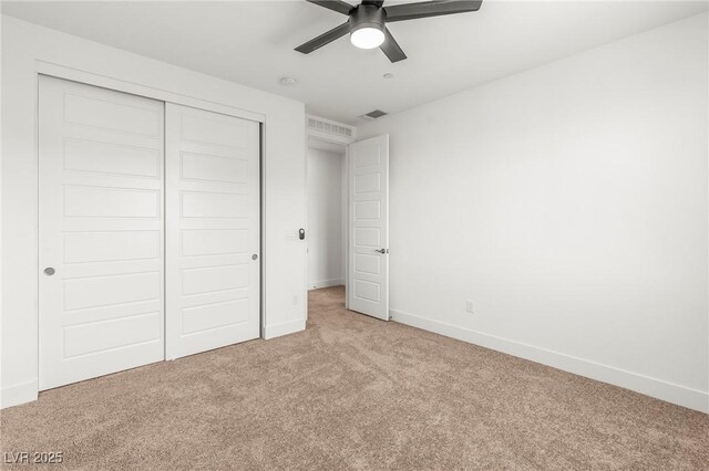 10851 Hanwicke Harbor Ave, Las Vegas, NV 89166 - unfurnished bedroom featuring light colored carpet, a closet, and a ceiling fan