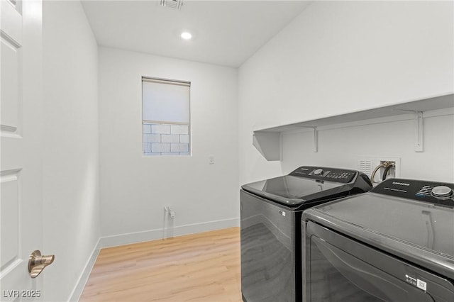10851 Hanwicke Harbor Ave, Las Vegas, NV 89166 - washroom with washer and clothes dryer, light wood-style flooring, baseboards, and recessed lighting