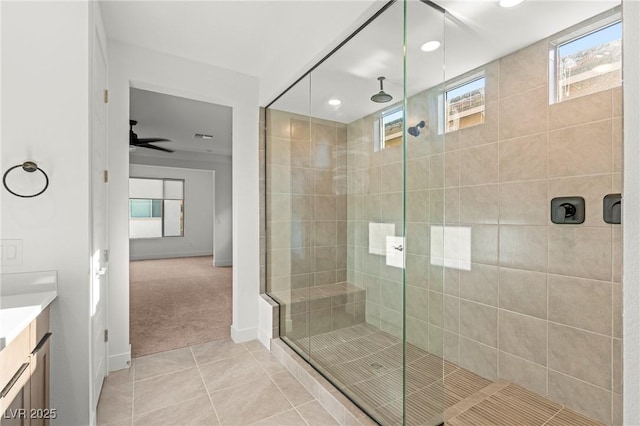10851 Hanwicke Harbor Ave, Las Vegas, NV 89166 - bathroom with tile patterned floors, a shower stall, vanity, baseboards, and recessed lighting
