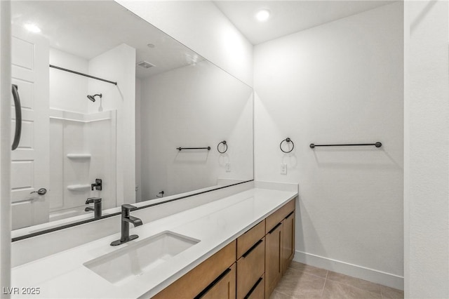 10851 Hanwicke Harbor Ave, Las Vegas, NV 89166 - bathroom with vanity, tile patterned floors, baseboards, and shower / tub combination