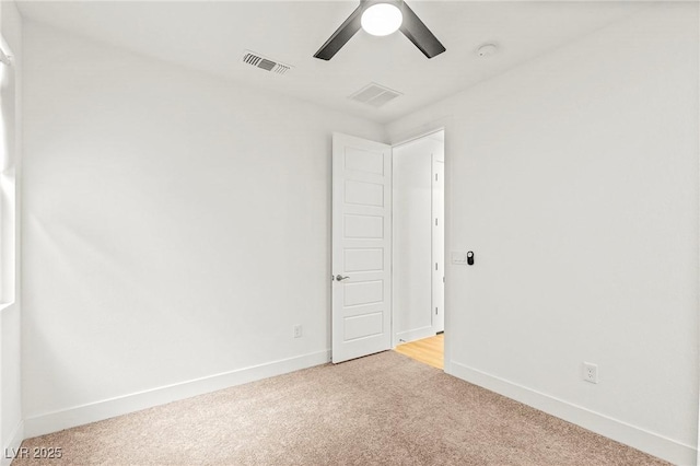 10851 Hanwicke Harbor Ave, Las Vegas, NV 89166 - unfurnished room with light colored carpet, ceiling fan, and baseboards