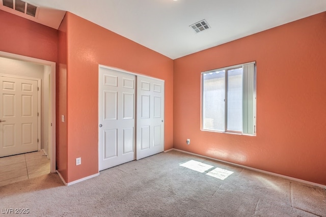 5960 Wheat Penny Ave, Las Vegas, NV 89122 - unfurnished bedroom with carpet flooring, a closet, and baseboards