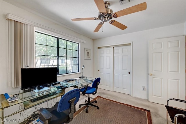 office with ceiling fan and carpet
