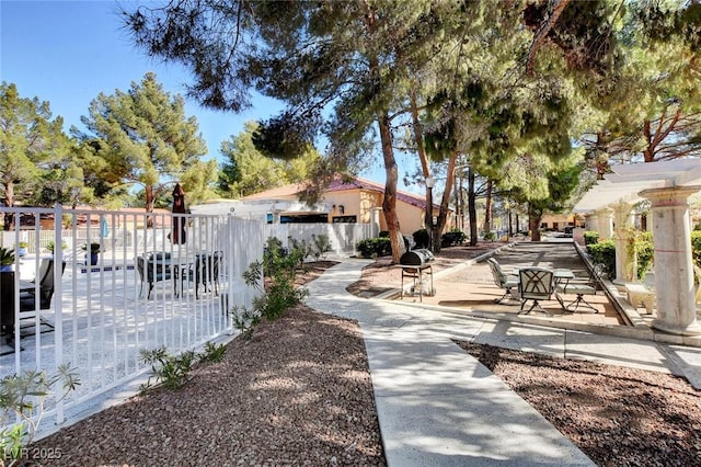 view of property's community with fence
