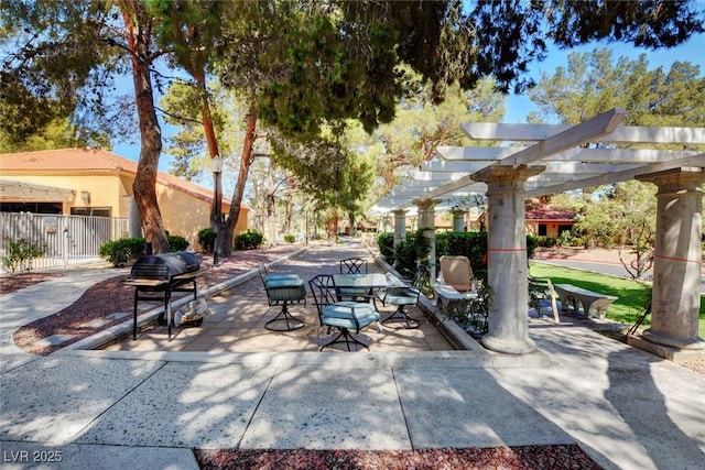 view of patio / terrace with a pergola, outdoor dining space, a grill, and fence
