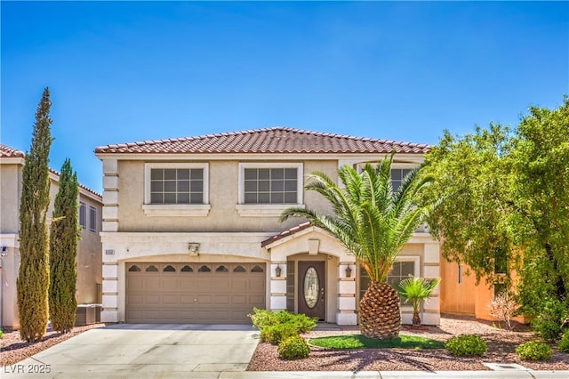 6559 Musette Ave, Las Vegas, NV 89139 - view of front facade with concrete driveway, stucco siding, a garage, and a tile roof