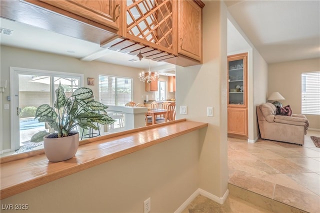 6559 Musette Ave, Las Vegas, NV 89139 - corridor with baseboards and a chandelier