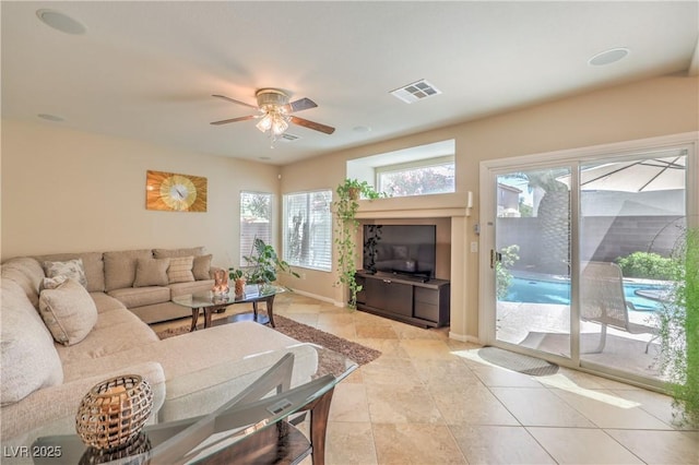 6559 Musette Ave, Las Vegas, NV 89139 - living room with a ceiling fan, baseboards, and light tile patterned floors