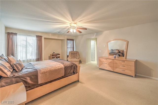 6559 Musette Ave, Las Vegas, NV 89139 - bedroom featuring light carpet, multiple windows, ceiling fan, and baseboards