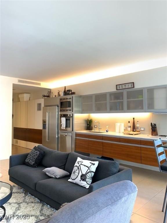 living area with light tile patterned flooring