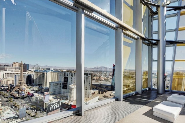 sunroom featuring a city view