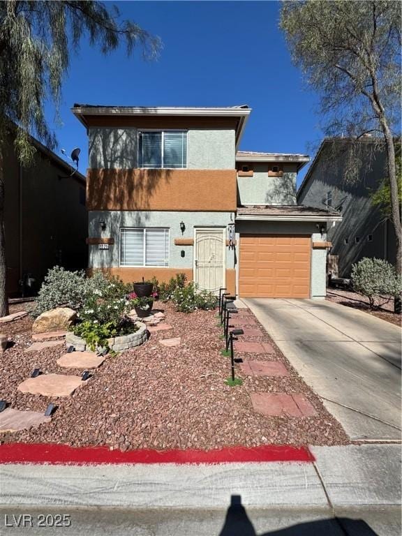 view of front of home with concrete driveway, stucco siding, and a garage
