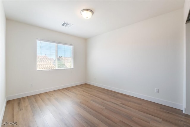 6821 Treble Clef Ave, Las Vegas, NV 89139 - unfurnished room featuring wood finished floors and baseboards