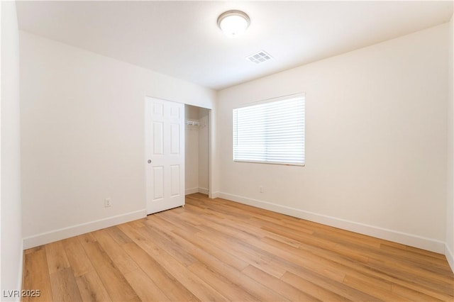 6821 Treble Clef Ave, Las Vegas, NV 89139 - unfurnished bedroom featuring baseboards, light wood-style floors, and a closet
