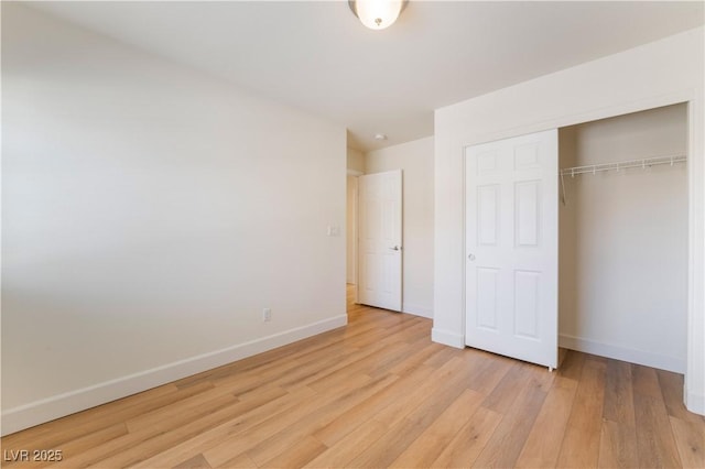 6821 Treble Clef Ave, Las Vegas, NV 89139 - unfurnished bedroom featuring baseboards, light wood finished floors, and a closet