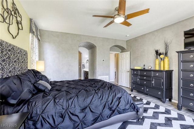 5650 Pleasant Palms St, North Las Vegas, NV 89081 - bedroom with arched walkways and ceiling fan