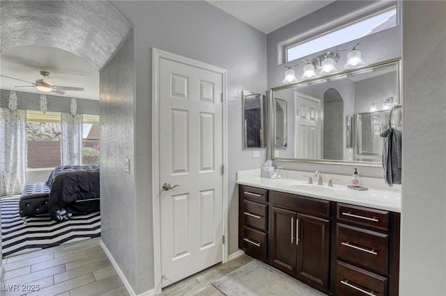 5650 Pleasant Palms St, North Las Vegas, NV 89081 - bathroom with a ceiling fan, vanity, wood finished floors, and baseboards