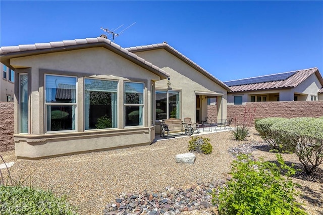 5650 Pleasant Palms St, North Las Vegas, NV 89081 - back of house with stucco siding, a patio, and a tiled roof