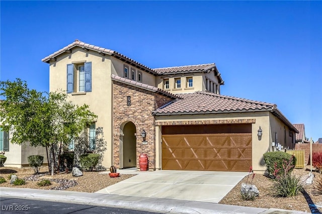 5650 Pleasant Palms St, North Las Vegas, NV 89081 - mediterranean / spanish home featuring a tiled roof, a garage, concrete driveway, and stucco siding