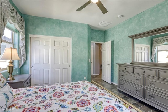 5650 Pleasant Palms St, North Las Vegas, NV 89081 - bedroom featuring wood finish floors, a ceiling fan, a closet, and baseboards