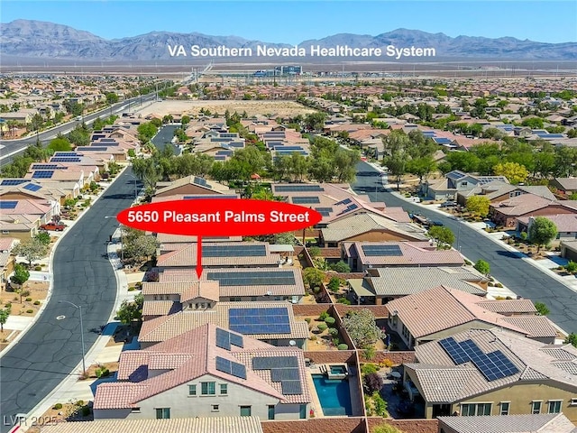 5650 Pleasant Palms St, North Las Vegas, NV 89081 - aerial perspective of suburban area with a mountainous background
