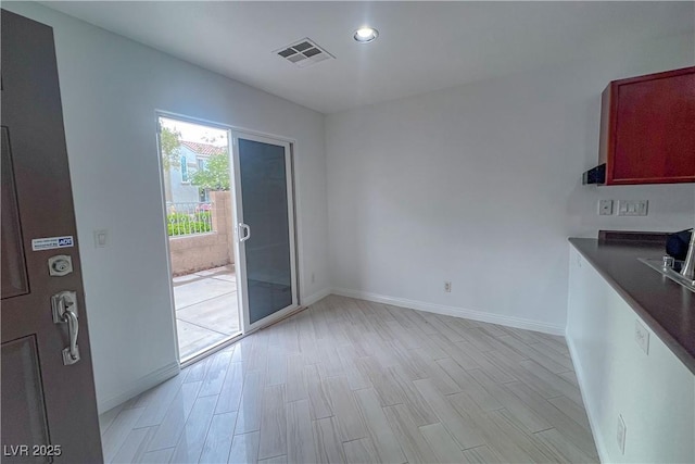 9148 Alluring Ave, Las Vegas, NV 89149 - unfurnished dining area with baseboards, recessed lighting, and light wood finished floors