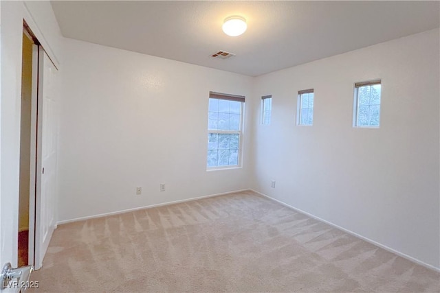 9148 Alluring Ave, Las Vegas, NV 89149 - unfurnished bedroom with light carpet, baseboards, and a closet