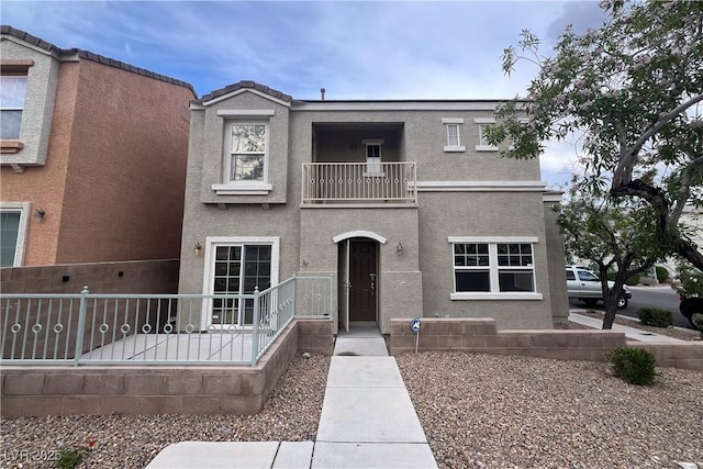 9148 Alluring Ave, Las Vegas, NV 89149 - townhome / multi-family property with a balcony and stucco siding