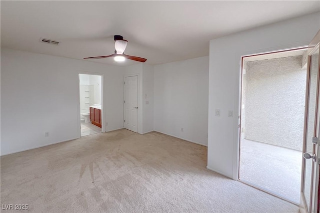 9148 Alluring Ave, Las Vegas, NV 89149 - unfurnished bedroom featuring light colored carpet, ceiling fan, and ensuite bathroom