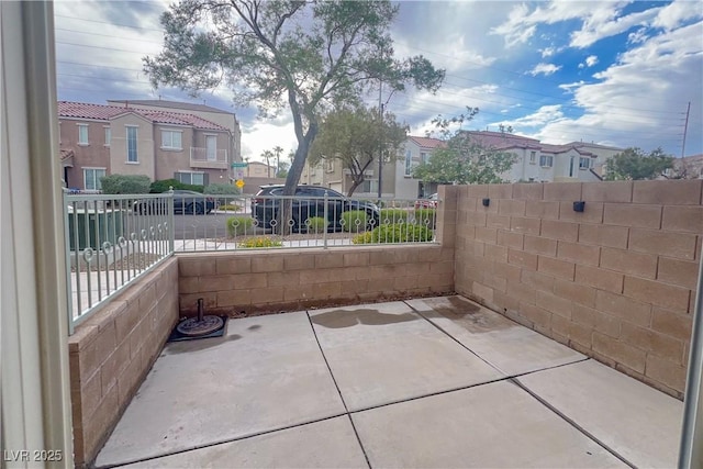 9148 Alluring Ave, Las Vegas, NV 89149 - view of patio / terrace featuring a residential view and fence