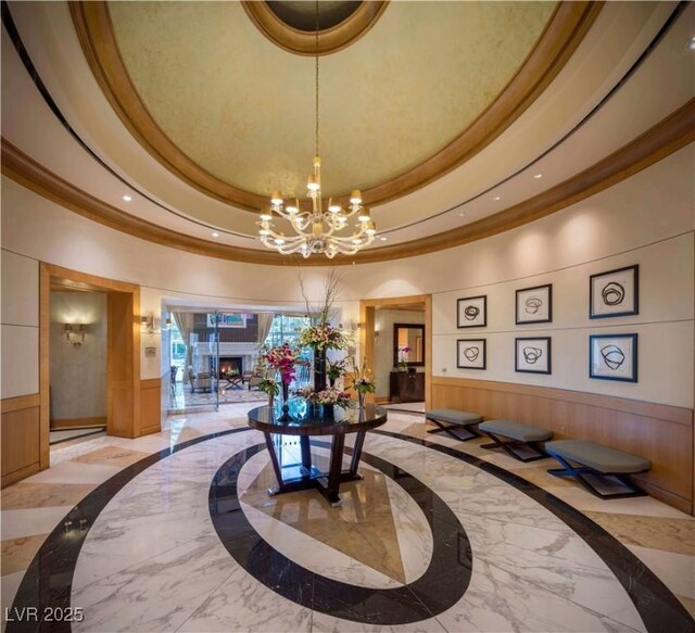 2777 Paradise Rd Unit 2701Ph, Las Vegas, NV 89109 - community lobby featuring crown molding, a wainscoted wall, recessed lighting, and a high ceiling