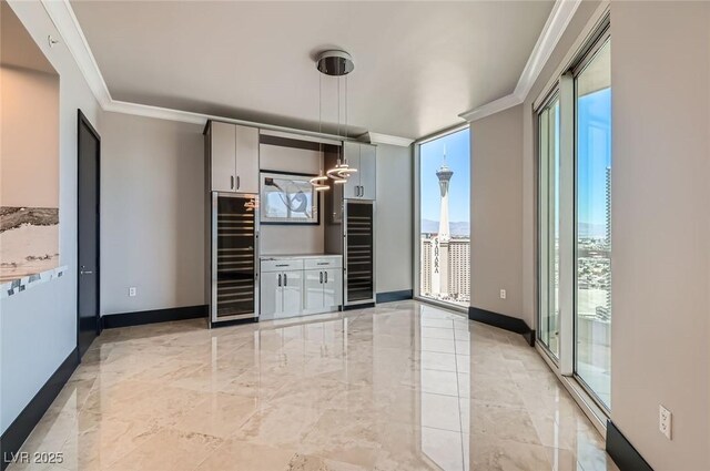 2777 Paradise Rd Unit 2701Ph, Las Vegas, NV 89109 - interior space with beverage cooler, crown molding, and light marble finish flooring