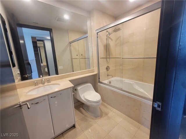 2777 Paradise Rd Unit 2701Ph, Las Vegas, NV 89109 - full bathroom featuring tile patterned floors, bath / shower combo with glass door, and vanity