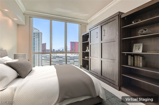 2777 Paradise Rd Unit 2701Ph, Las Vegas, NV 89109 - bedroom featuring a view of skyline, crown molding, and a wall of windows